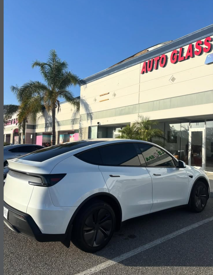 White Tesla Model Y with dark tint